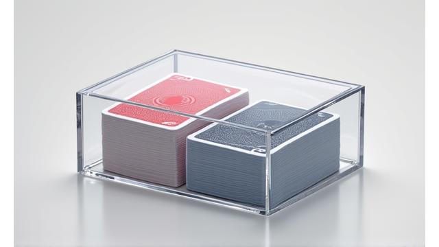 A neatly organized stack of playing card decks inside a sleek, custom storage box.