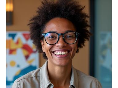 A game designer animatedly discussing their board game concept during a virtual interview, showcasing their passion.